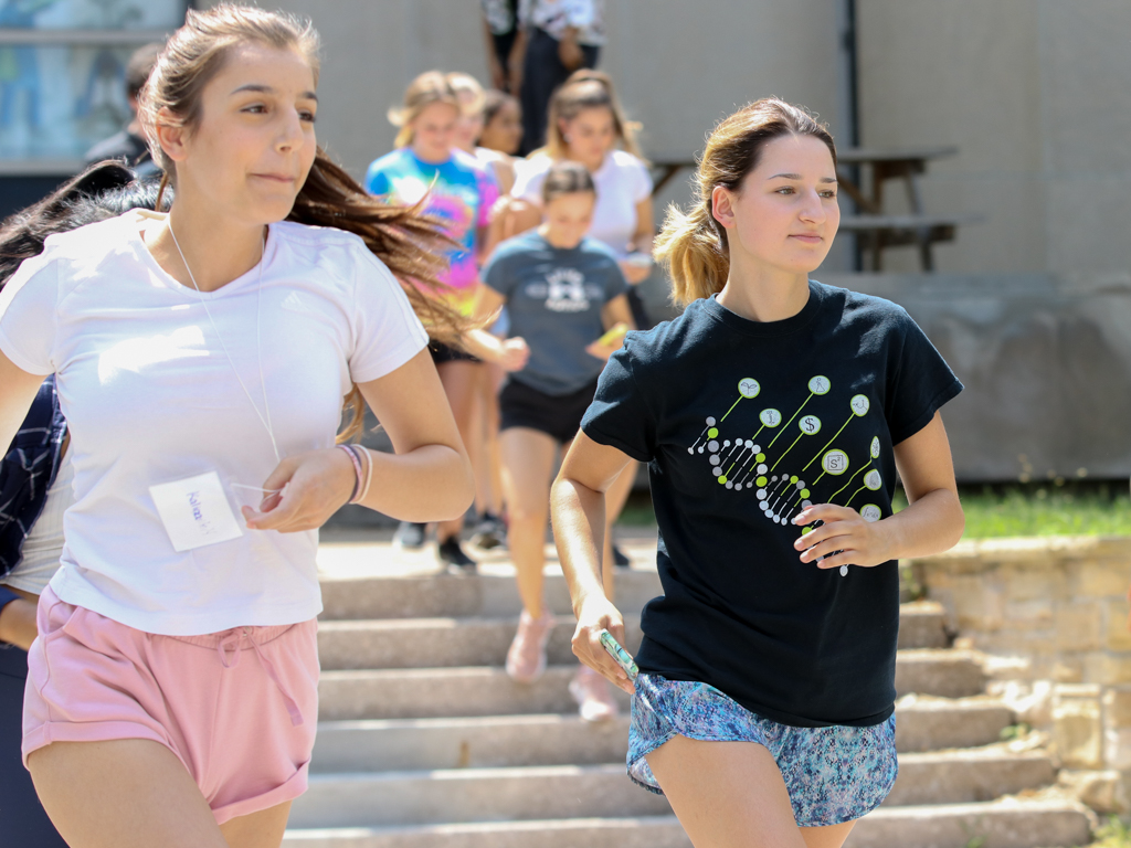 A Grade 11 participant and undergraduate leader participate in the "Amazing Race" event during the UWindsor Science Academy on Wednesday, July 11, 2018.