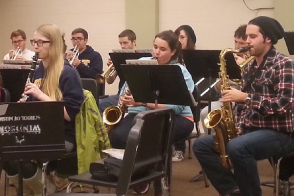 Members of the Lancer pep band practice one of their pop songs in the Music Building.