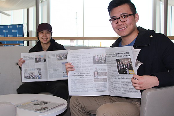 onnie Ton and Tony Meng show off the articles they contributed to the Odette Business Review.