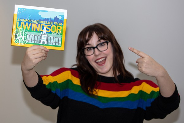 Maddie Renaud shows off a UWindsor offer of admission package.