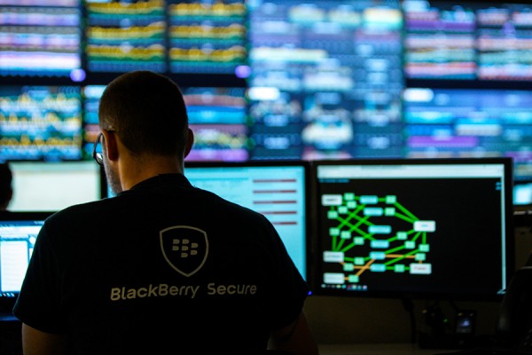 person at computer screens in the BlackBerry Network Operations Centre