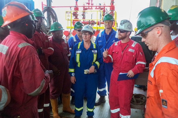 Pamela Nadin-McIntyre meets with a drilling team.