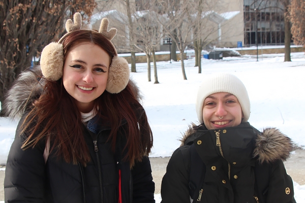 Hailey Chedore and Katie Savage bundled in winter clothing