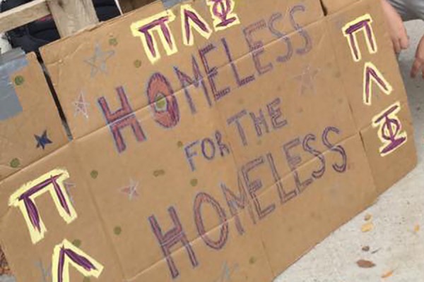 sign hand-lettered to read Homeless for the Homeless