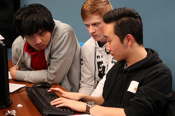 A team from Leamington District Secondary School works on code during the Regional Secondary School Computer Programming Competition, December 1 at the University of Windsor.