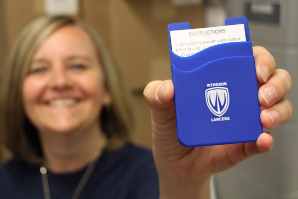 Bookstore clerk Marnie Pinkney shows off the Lancer smartphone wallet, available for just $4.50.