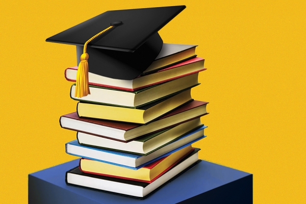 academic cap atop stacked books