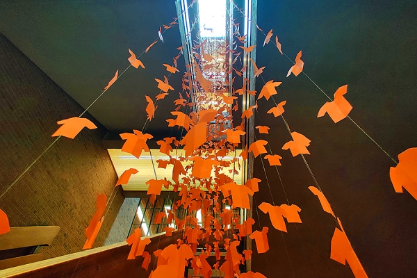 art installation orange paper shirts