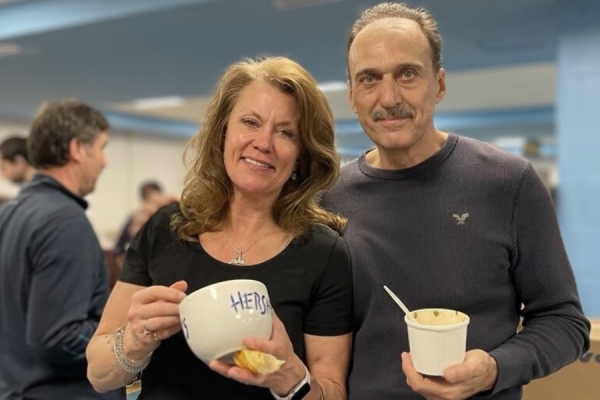 Mary Brownlie and Johnny Murer holding bowls of soup