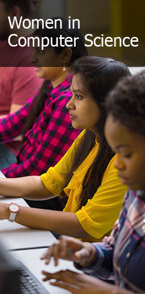 Females students at computer monitors