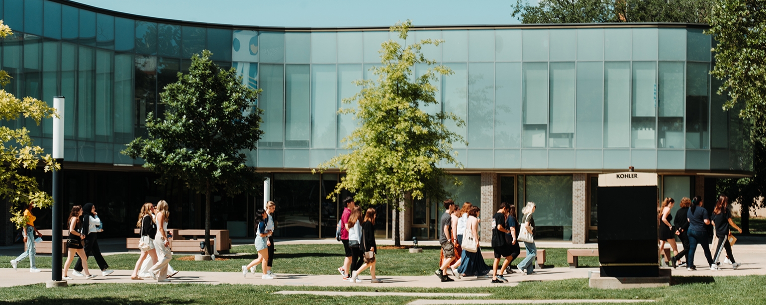 TOUR GROUP WALKING ACROSS CAMPUS