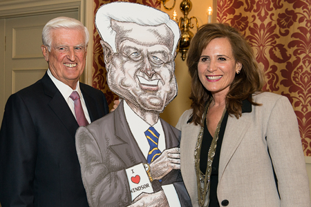 Ed Lumley with Sandra Pupatello and an oversized caricature of himself.