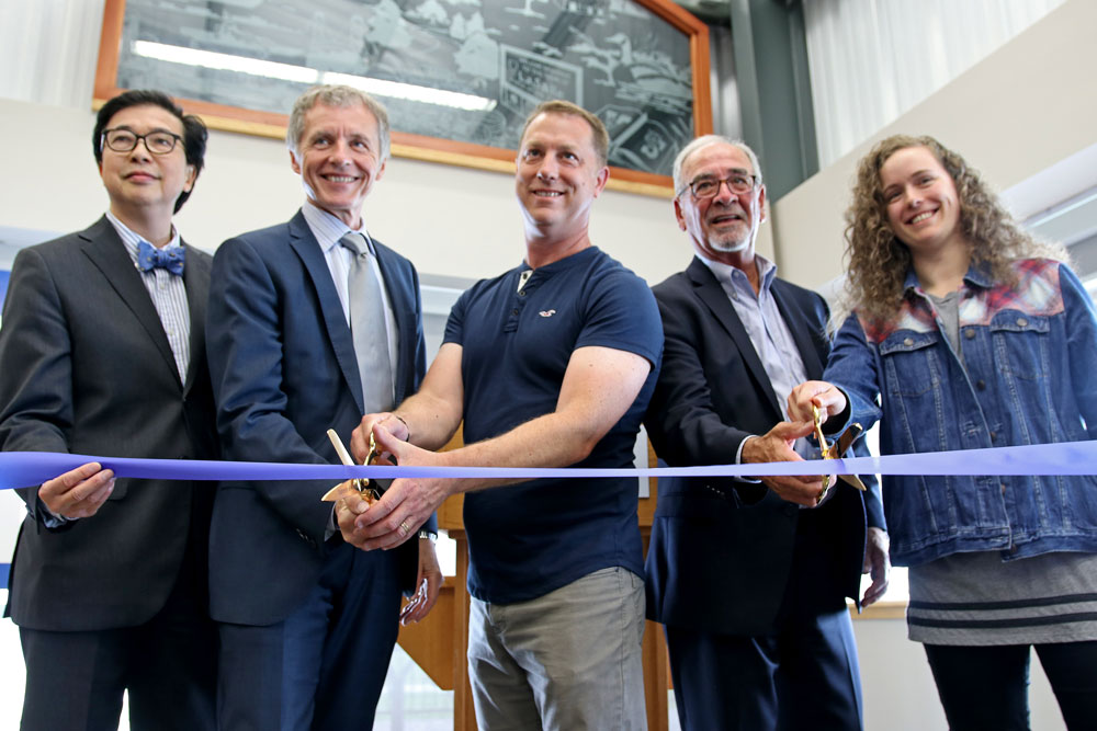 University of Windsor's Dr. Michael Siu, Dr. Alan Wildeman, Dr. Trevor Pitcher, LaSalle Mayor Ken Antaya and student Marlena McCabe cut the ribbon at the grand opening of the Freshwater Restoration Ecology Centre.